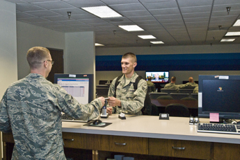 Two airmen at check-in counter